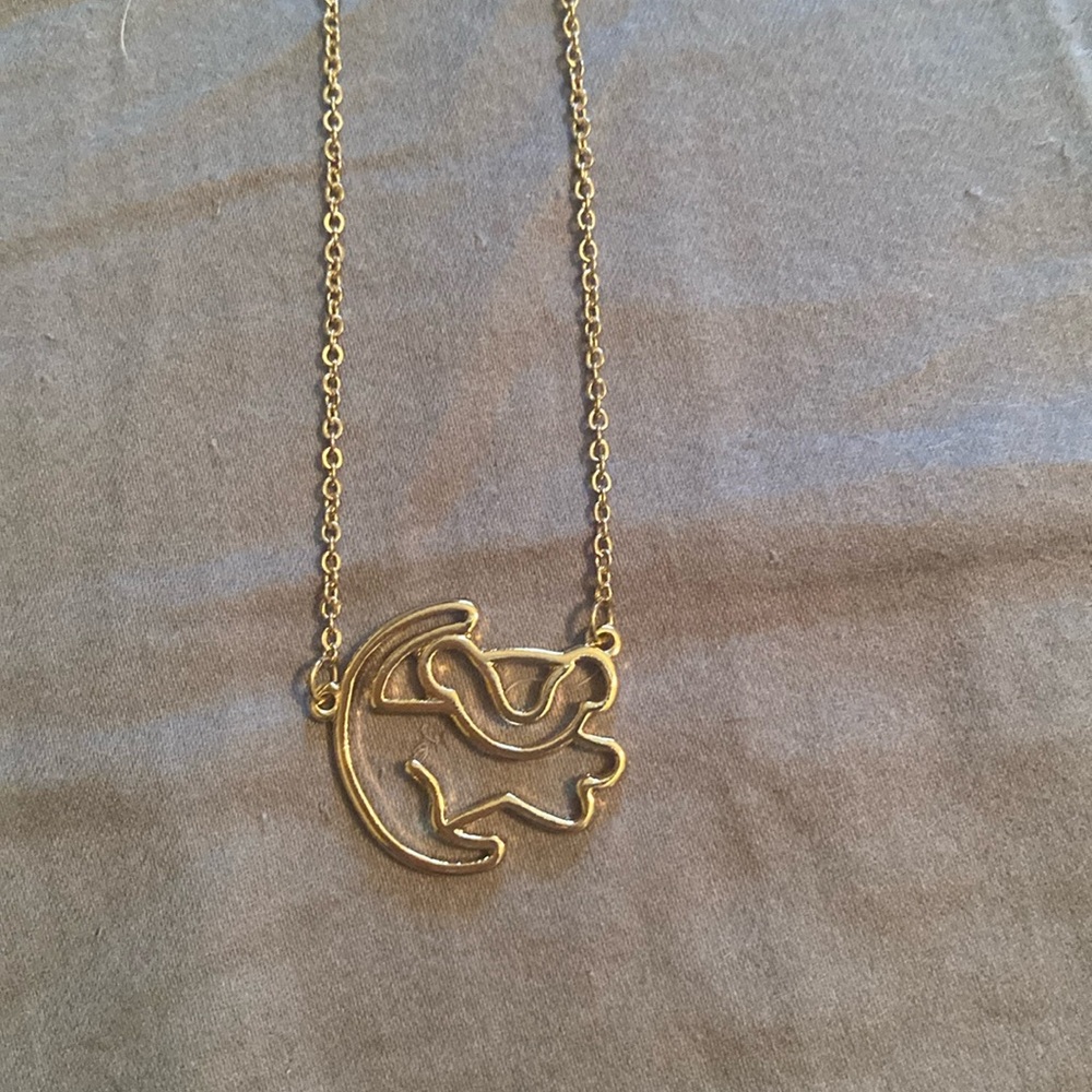 Official Disney merchandise. Gold Simba necklace. Like new condition.